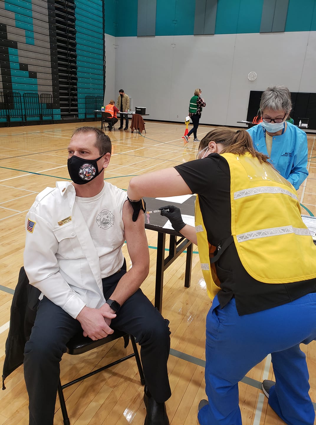 Fire Chief Ravagnie getting his first dose of the vaccine.