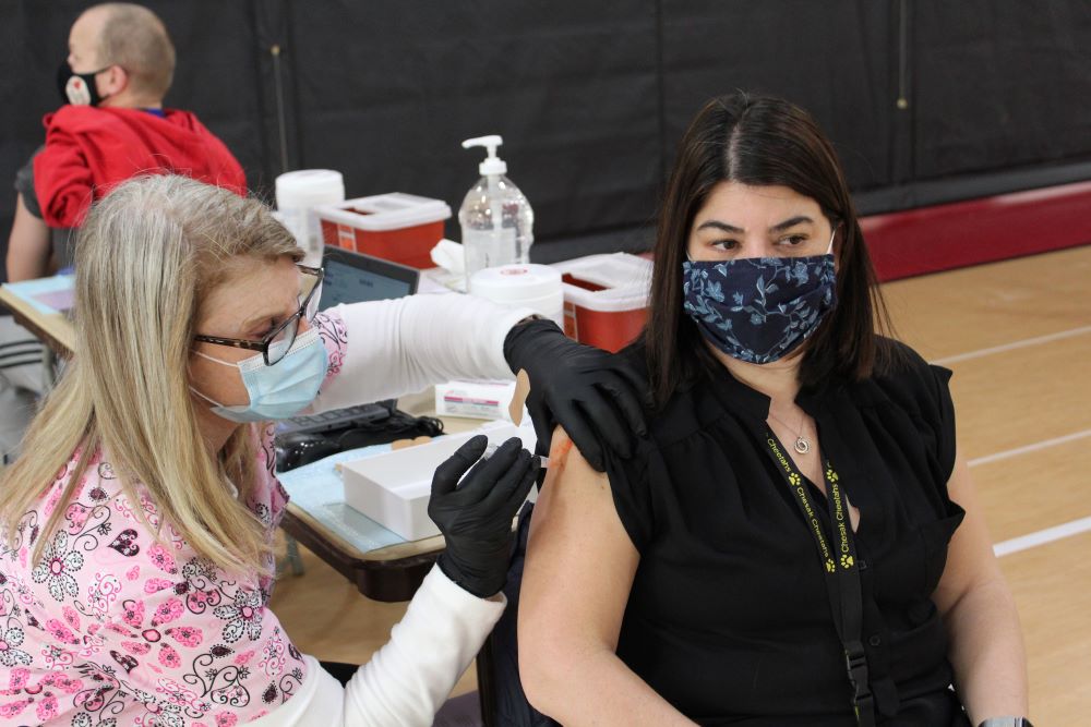 Chesak Elementary School principle Jennifer Zayas getting her COVID-19 vaccine