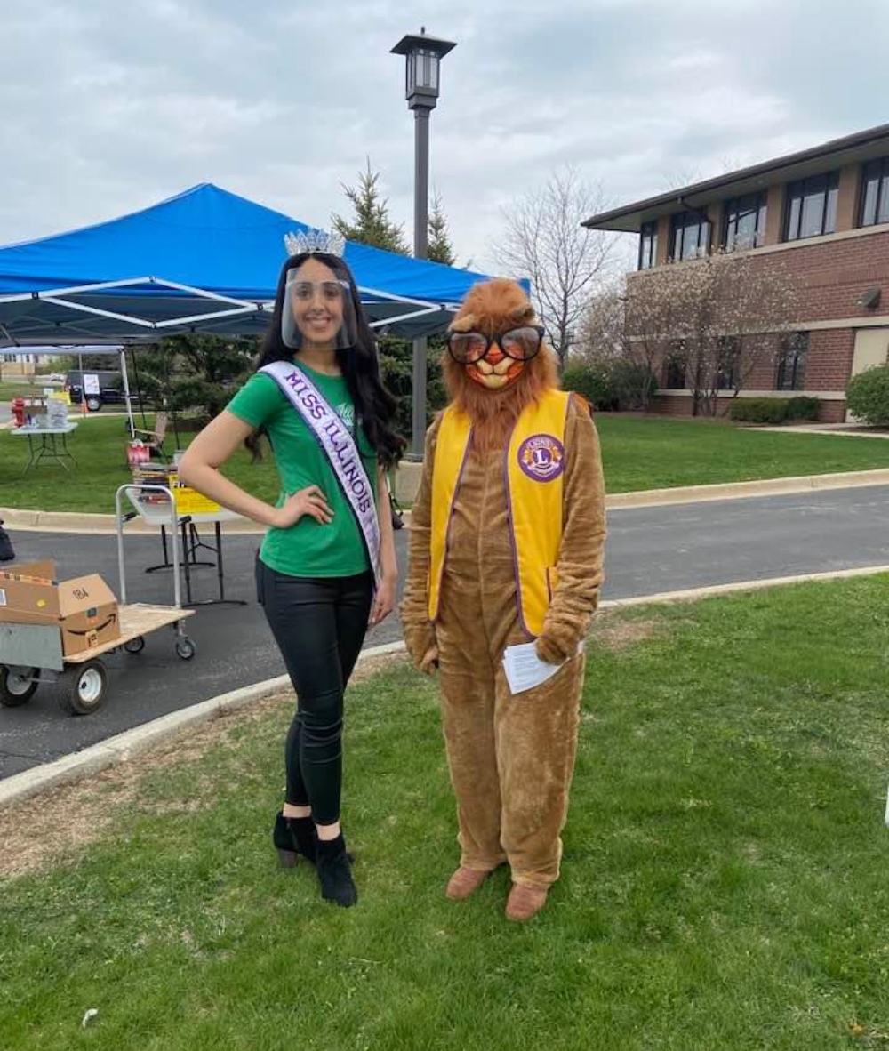 Miss Illinois Deepa Dhillon and Huntley Area Lions Club Vice President Pam Palmer as Lucy Lion at a Lions Club event