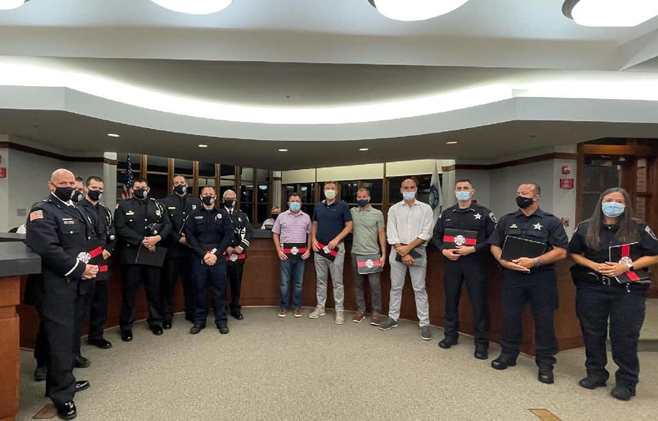 Several police officers and community members were honored at a LITH Village Board meeting for saving the life of a child in an incident that occured on July 23