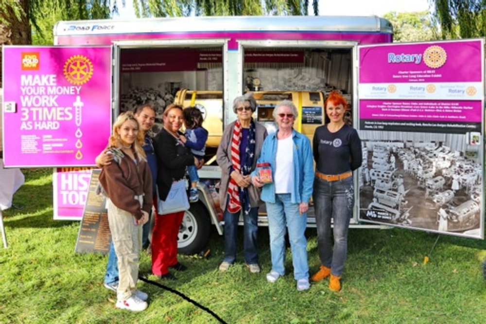 From right to left- Tetyana Torzhevska, Karen Hutchings and Nancy Hufty, Rotarians, explained the iron lung traveling museum to Huntley Fall Fest vistors