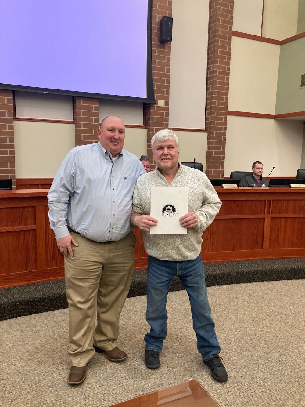 Huntley Mayor Tim Hoeft (Left) honored Paul Ostrander (Right) at the March 10 Village Board meeting for serving 33 years at the Huntley Park District.