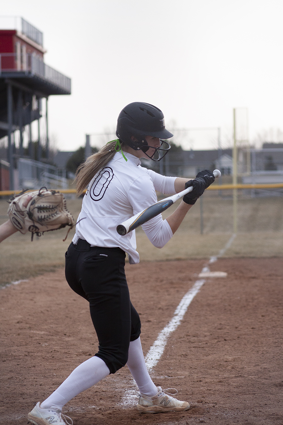 Huntley senior Jori Heard takes a swing for a sixth inning home run against Fremd, The hit gave the Red Raiders a 2-1 lead and they went on to win 3-2. Heard struck out 18 Vikings. Huntley had a 1-1 record.