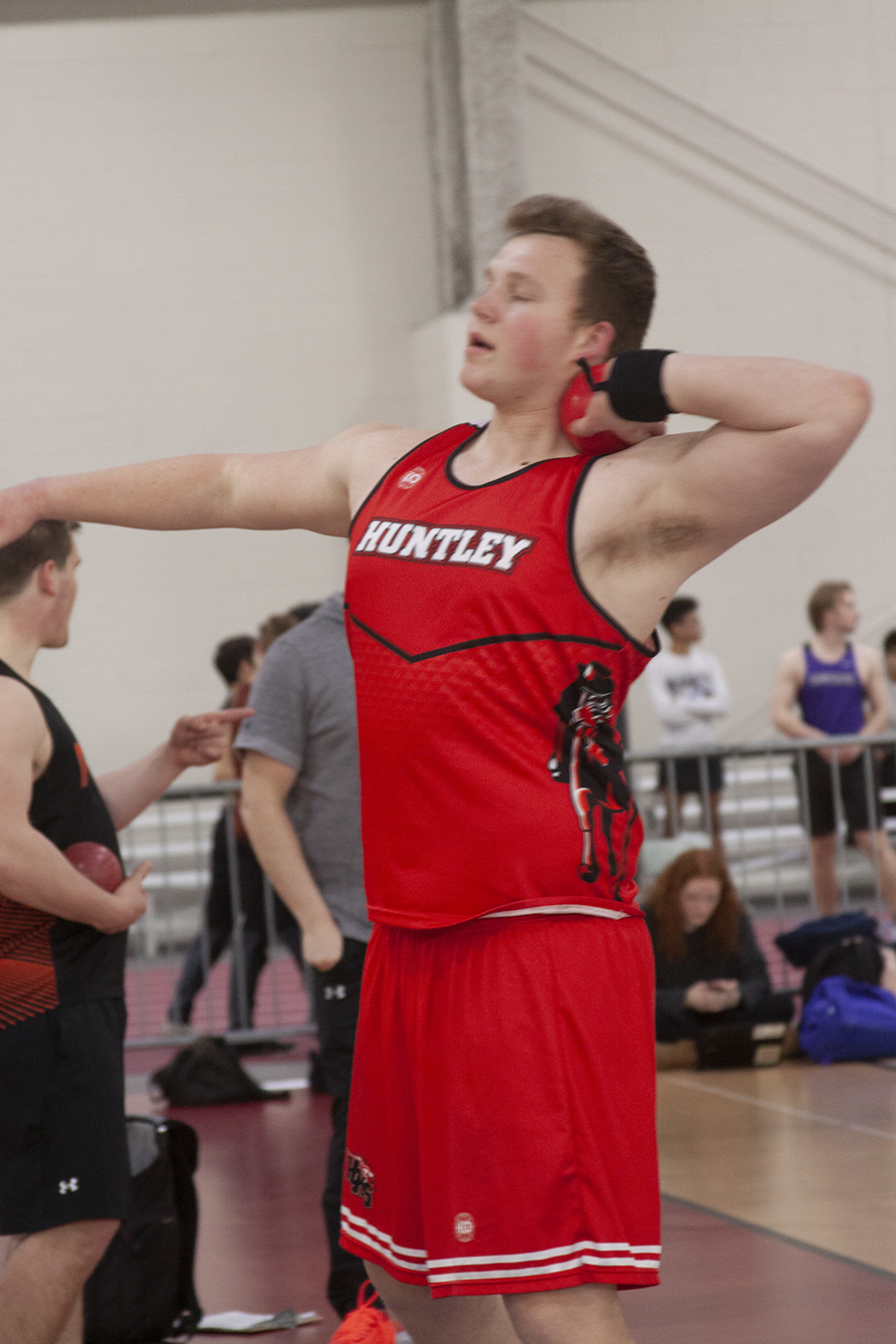 Huntley senior Hayden Swim concentrates before throwing the shot put at the Fox Valley Conference indoor track meet. The Red Raiders are preparing for the outdoor portion of the season.