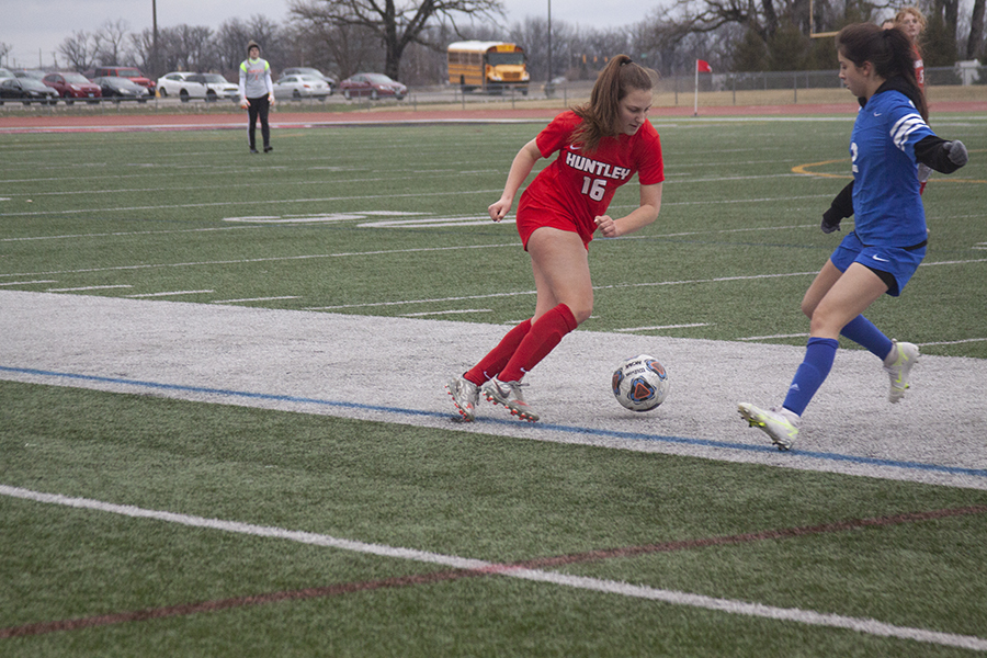 Huntley girls soccer senior forward Kaitlyn Gulver sets up a play in a match against Elgin Larkin