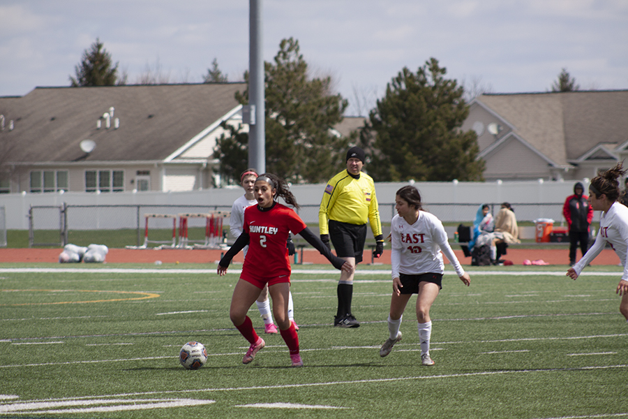 Huntley girls soccer sophomore Gabriella Farraj seeks control of the ball against Rockford East April 16. HHS won 4-0.