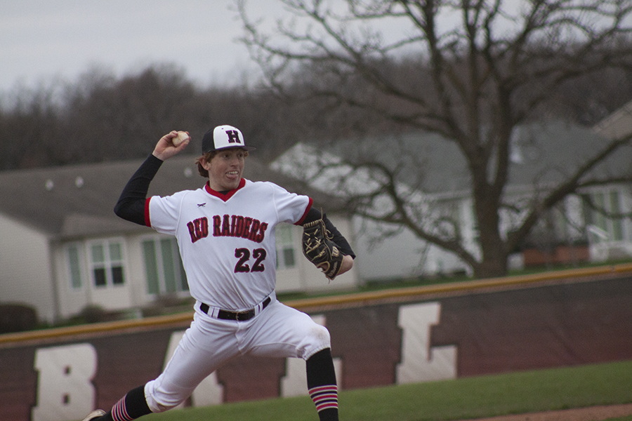 Huntley pitcher Adam Guazzo fires a strike home April 25 against Jacobs. The host Red Raiders won 10-0 in six innings Rivals Huntley and Jacobs clashed in two games with control of the Fox Valley Conference lead at stake April 23 and 25. 