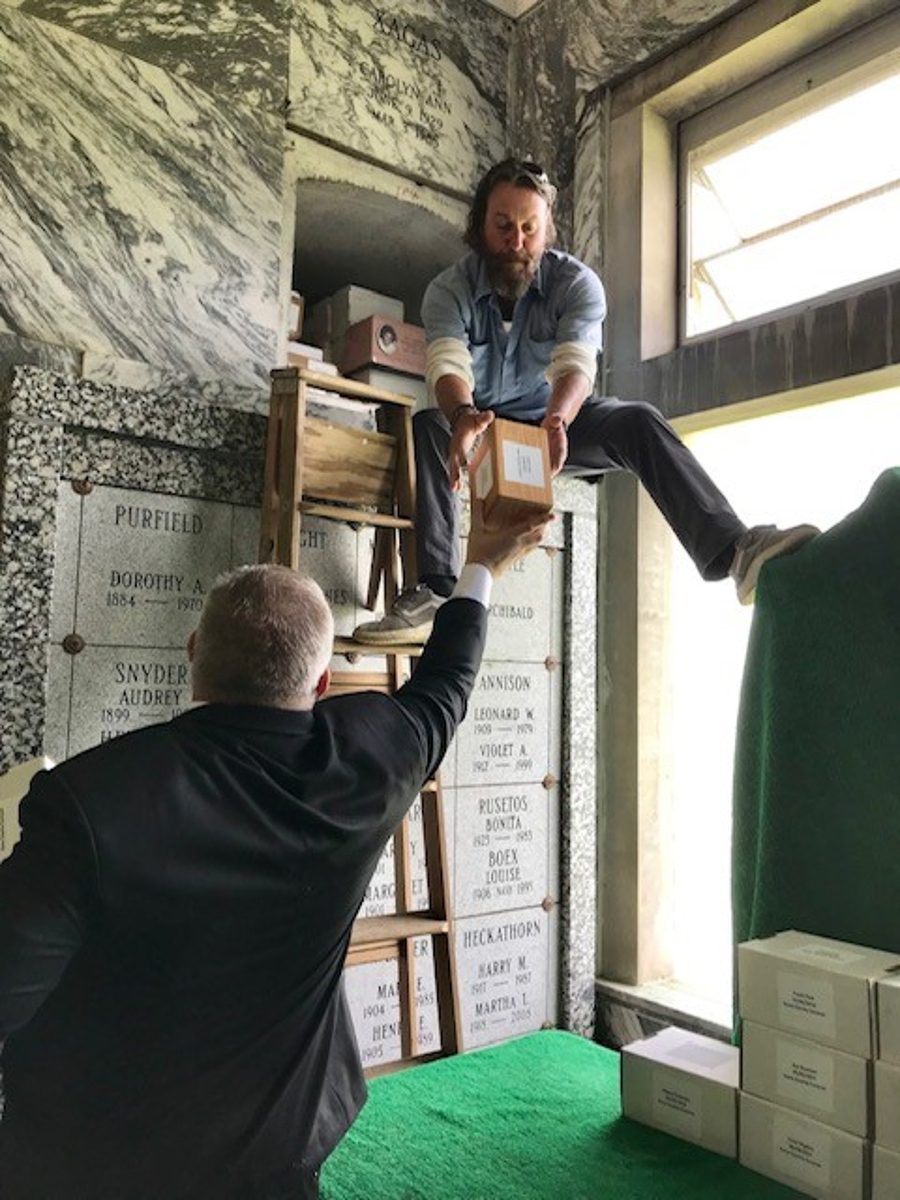 Kane County Coroner Rob Russell assists in one of the non-denomonational memorials in St. Charles to lay unclaimed remains to rest