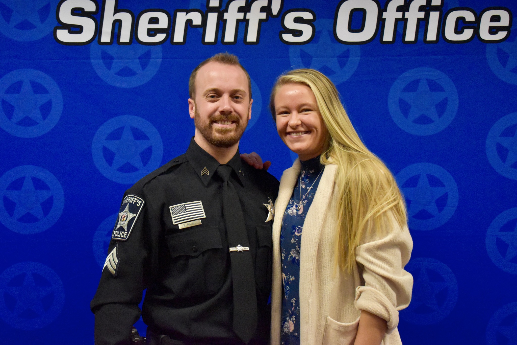 McHenry County Sheriff's Office Sergeant Trent Raupp and his wife pose for a photo shortly after he was promoted to hi new position in January
