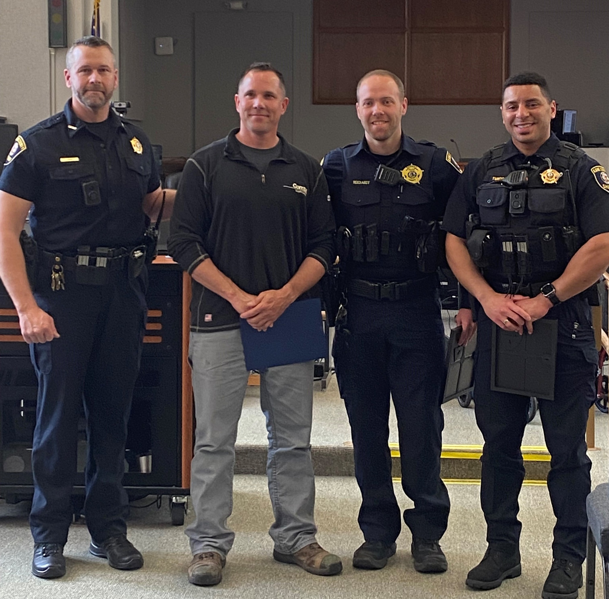 (From Left to Right) Kane County Sheriff Ron Hain recognized ComEd employee Michael Curtis and Sheriff's Deputies Ryan Reichardt and Steven Turcios for their heroic actions