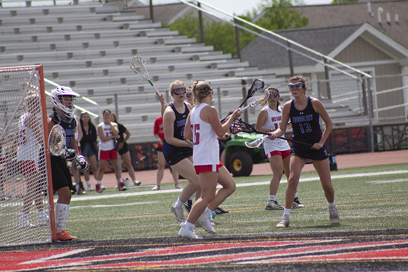 Huntley and Rosary High School players clash in front of the Rosary goal in a match at HHS.