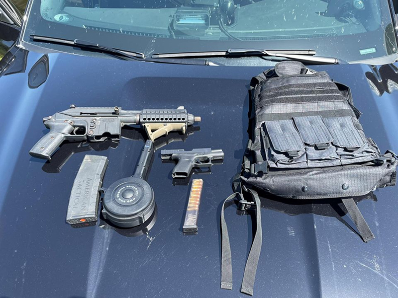 Kane County Sheriff's detectives seized several illegal guns and a bullet proof vest from two vehicle occupants in Hampshire Township