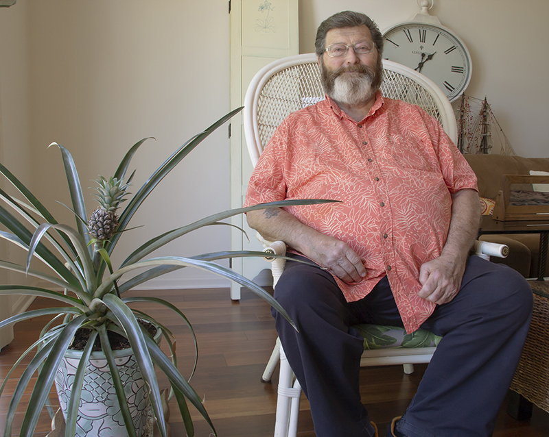 Huntley resident Bob Begora and his pineapple plant.