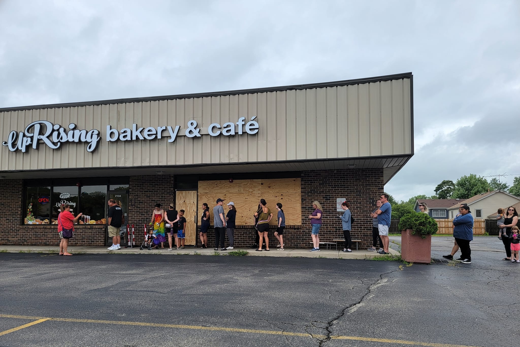 Residents lined up outside of UpRising Bakery & Cafe on July 24 in support of the local business after it was vandalized in a hate crime incident