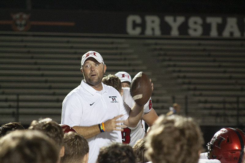 Huntley head football coach Mike Naymola holds the game ball after the Red Raiders beat Crystal Lake Central 37-20 Aug. 26 in the season opener. HHS's home opener is Sept, 2 against McHenry.