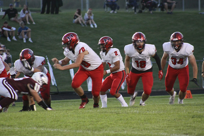 Huntley's offense begins a play with Trent Regaldo, Cam Mueller, Sam Deligio, Omare Segarra and Haiden Janke leading the way.