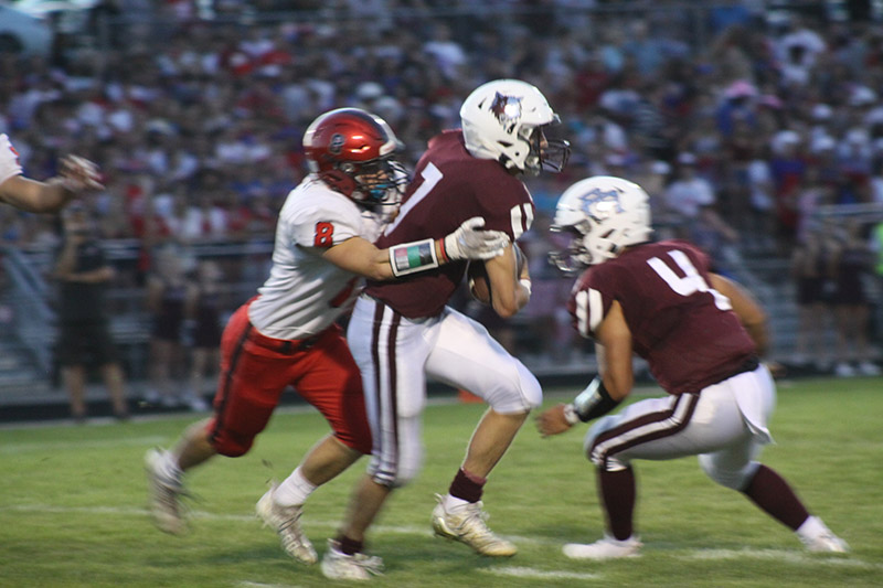 Huntley linebacker Joey Arvidson tackles Prairie Ridge quarterback Tyler Vasey Sept. 9 at Prairie Ridge. The Wolves won the Fox Valley Conference game 35-7.