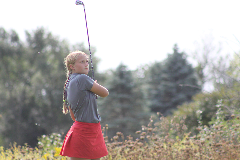 Huntley's Aubrey Dingbaum concentrates on a tee shot at the McHenry County Invite. The Red Raiders then won the Fox Valley Conference girls golf tournament held Sept. 21 at Crystal Woods Golf Club.