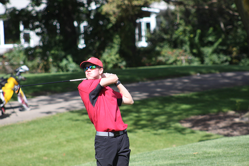 Huntley's Nooa Hakala watches a tee shot during the Fox Valley Conference boys golf meet Sept. 22 at Randall Oaks Golf Club. HHS won the tournament championship.