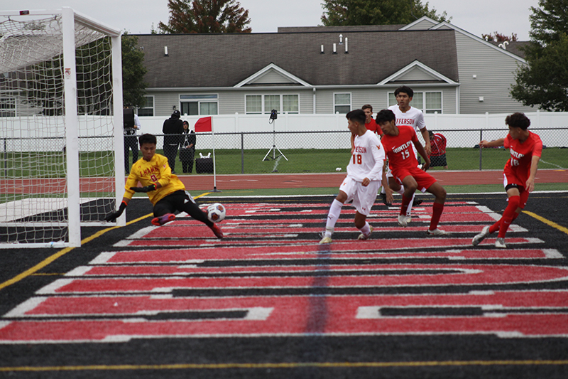 Huntley's Ansel Dias attempts to score a goal against Rockford Jefferson Sept. 24. Dias scored one goal in the Red Raiders' 4-0 victory. Teammate Isaac Jacobo looks on.