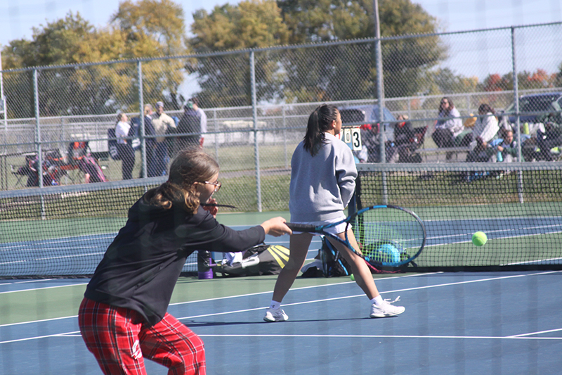 Huntley second doubles player Delaney Stock and partner Emily Chong (at net) battle during the Fox Valley Conference title match with Prairie Ridge. The Red Raiders captured won the Fox Valley Conference title Oct. 8.