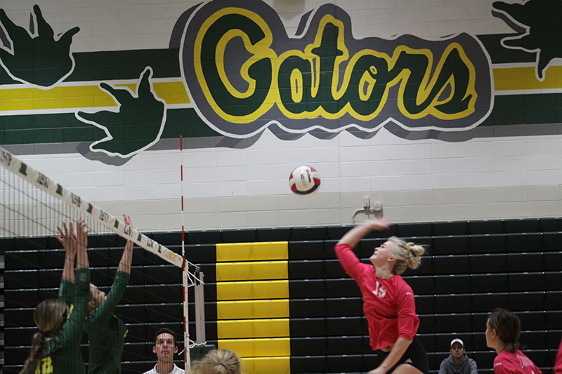 Huntley's Allyson Panzloff goes for a kill against Crystal Lake South. The Red Raiders completed an 18-0 Fox Valley Conference season with a 2-0 win over the Gators Oct. 20. All three HHS volleyball teams recorded 18-0 FVC records.