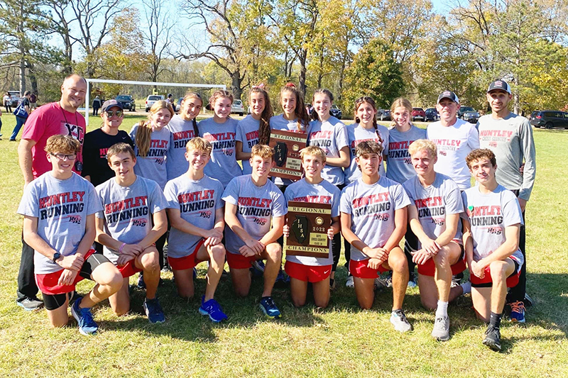 Huntley's cross country teams both won the team championships at the Class 3A Machesney Park Harlem Regional Oct. 22. Front row from left to right: Andrew Raistrick, Logan Barreto, Zach Zuzzio, Luke Grubbs, Tommy Nitz, Jaden Gutierrez, Hudson Fisher and Ty Rasmussen. Back row from left to right: assistant coach Joe Munson, assistant coach Brandy Swanson, Cori Kilvinger, Guille-Gimenez Cunat, Ava Allison, Brittney Burak, Breanna Burak, Molly Allen, Gabby Sweeney, Aspen Maldonado, head coach Matt Kaplan, assistant coach Jimmy Jestus.