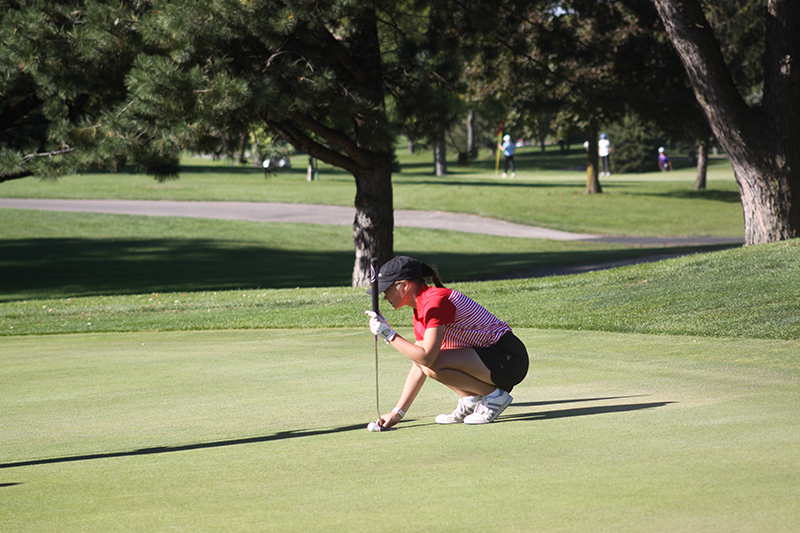 Huntley senior Abby Panier prepares to putt during the IHSA Class 2A Huntley sectional at Pinecrest Golf Club Oct. 3.