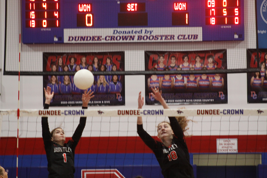 Huntley's Maggie Duyos, left and Emily Willis battle at the net at the Class 3A Dundee-Crown super sectional Nov. 4 against Barrington. Barrington won, two sets to one.