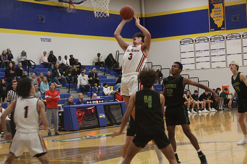 Huntley senior Ty Goodrich takes a shot at the basketball in the Johnsburg Thanksgiving Tournament championship game against Crystal Lake South Nov. 25. HHS fell to the Gators, 53-49, but started the season with a 3-1 record.