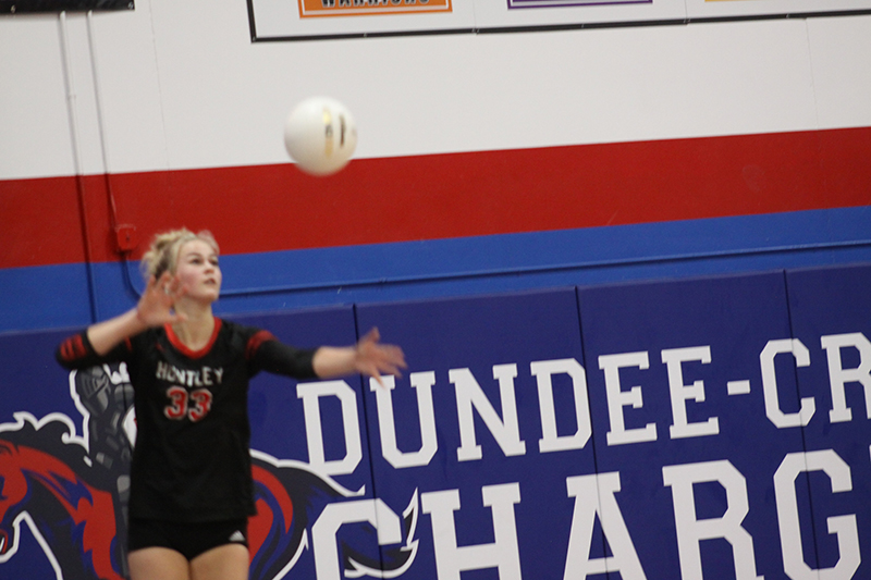 Huntley senior Ally Panzloff serves during the super-sectional match against Barrington. Panzloff was one of the Red Raiders' selections on the All-Fox Valley Conference team.