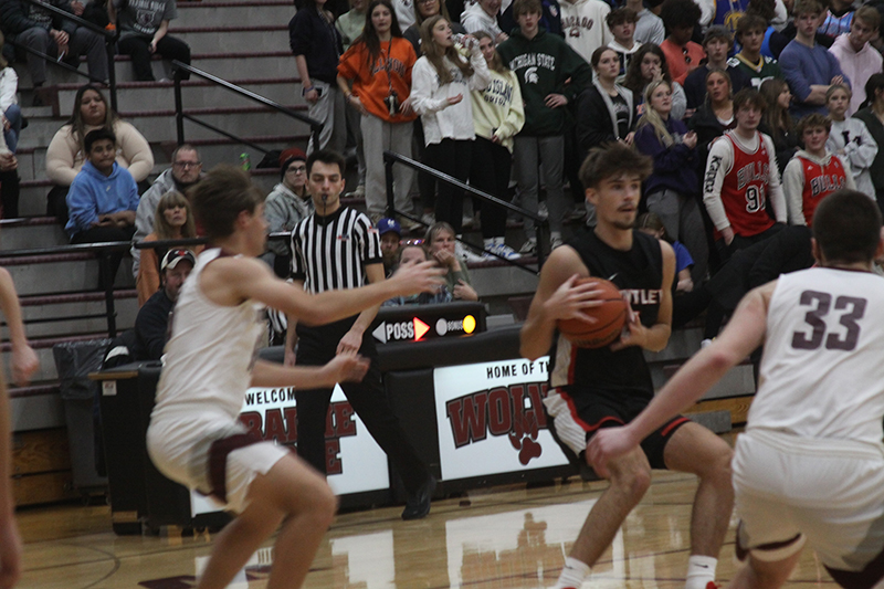 Huntley senior Ian Ravagnie sizes up a shot during a boys basketball game at Prairie Ridge. Ravagnie made seven three-pointers as the Red Raiders won, 69-53, Nov. 30.