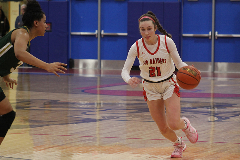 Huntley senior Sammi Campanelli drives against a Stevenson defender at the Dundee-Crown holiday tournament. Campanelli scored a career high 25 points against Lincoln Way East Jan. 14.