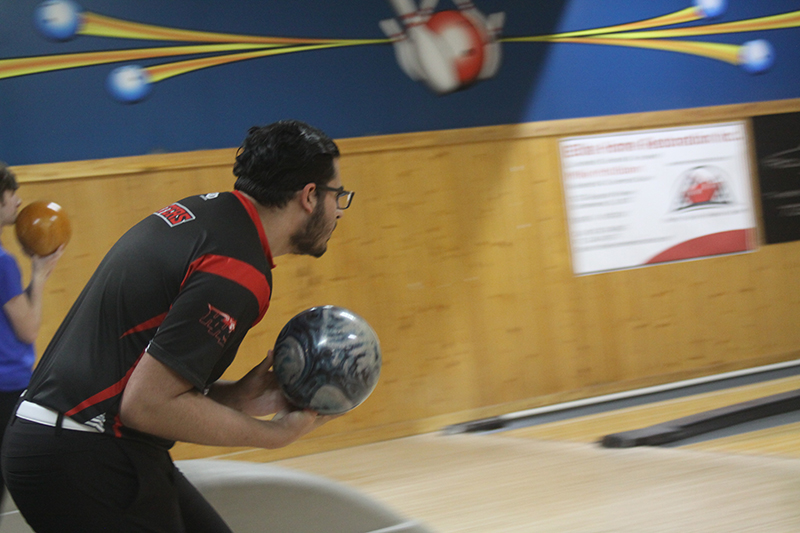 Huntley senior Joshua Waters concentrates before throwing a ball during the Red Raiders battle with St. Charles North Jan. 11. Waters was one of four seniors honored for senior night.