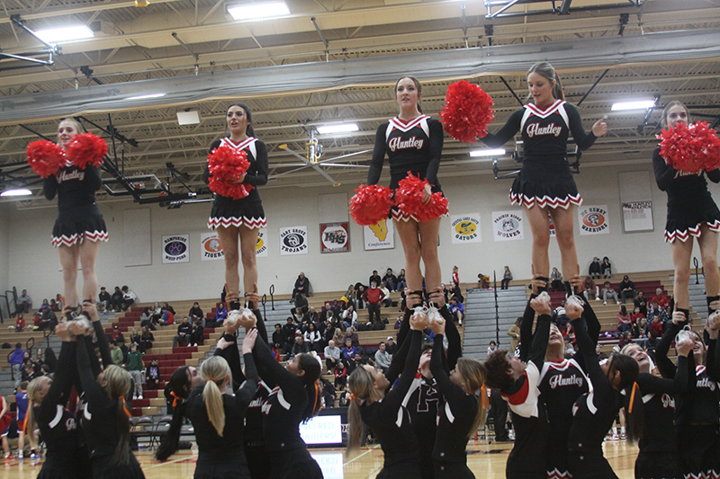 Huntley cheerleaders lead the crowd in cheers at the Jan. 13 boys basketball game.