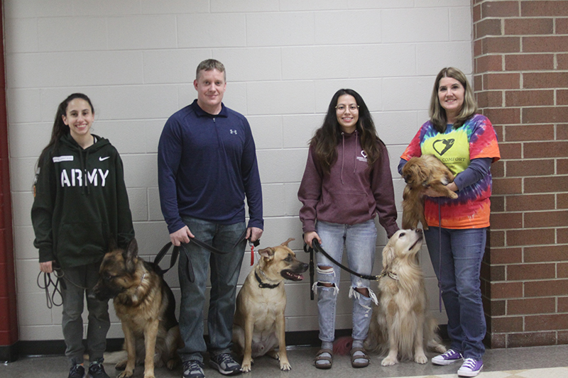 Canines 4 Comfort brought Psychiatric Service Dogs to the Huntley District 158 Mental Health Awareness Resources Night. From left to right: Daria Wermli, Dave Clark, Nina Tovar and Lisa Wermli.