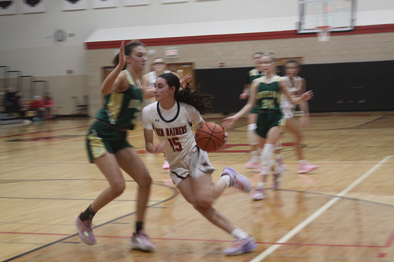 Huntley senior Jessica Ozzauto drives toward two points. Ozzauto was named to the all-tournament team at the Dundee-Crown Holiday Classic.