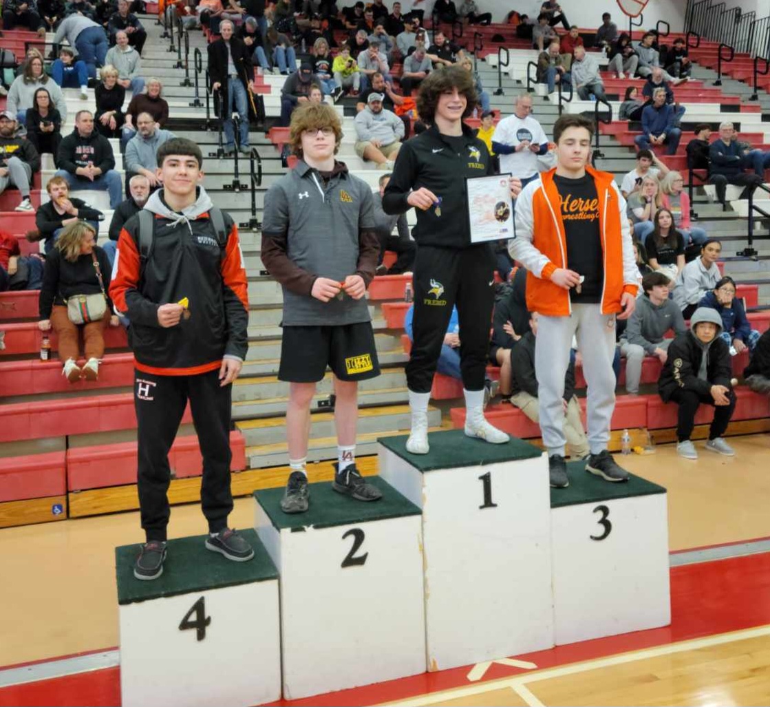 Huntley's Adam Pena, first from left, stands at the podium after finishing fourth at the Class 4A Barrington Sectional. Pena qualified for the IHSA State Meet Feb. 16-18.