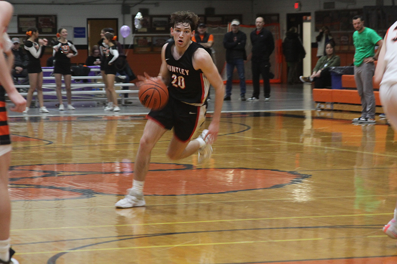 Huntley's Ethan Blackmore drives to the basket against Crystal Lake Central. HHS won the Fox Valley Conference game 66-35 Feb. 10.