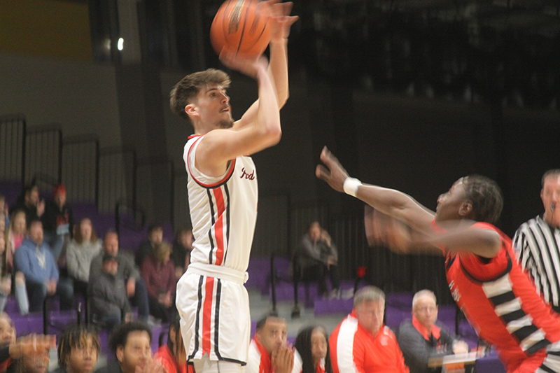 Huntley senior Ian Ravagnie shoots for two of his 20 points against Rockford East. The Red Raiders won the Hononegah Class 4A regional championship with a 49-48 victory over Rockford East Feb. 25.