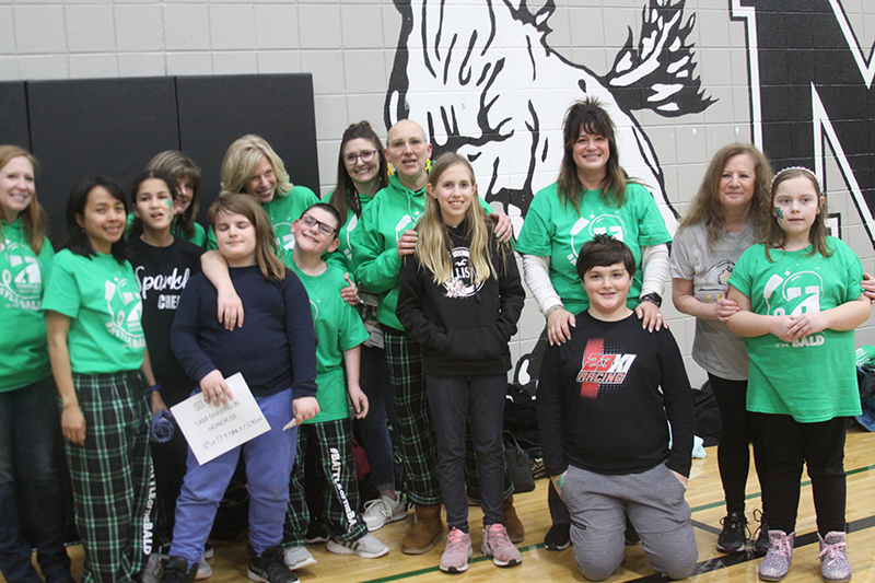 Family members, friends and teachers for Matthew Erickson, attend the St. Baldrick's "Battle of the Bald" event. Erickson was diagnosed with a brain cancer just after birth. Front row from left: Kent, Dekasha and Matthew Erickson, Olivia Jensen and Joey Tunzi. Back row: Jen Boyd, Angela Imelda, Gabbi Ford, Chris Normington, Debi Ryan, Tricia Boskey, Jennifer Slad, Sara Tunzi, Merele Haslan and Julia Przybowski.