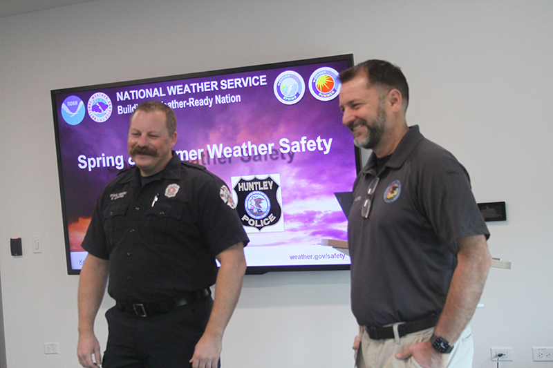 Pat Ullrich, Emergency Response and Preparedness manager for the Huntley Police Department, holds a NOAA all-hazards weather radio.