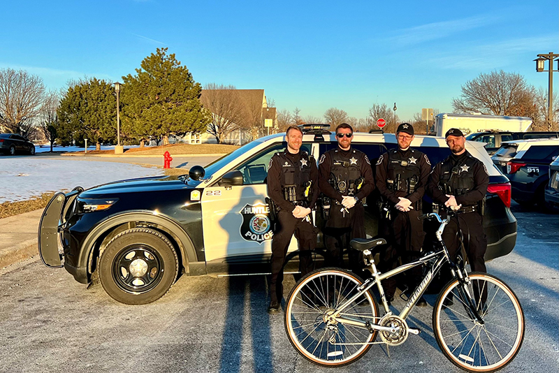 Huntley Police Officer Joe Lanute assisted a local bicyclist with a replacement bike after assisting him get home in winter weather. Officers on the shift were, from left: Nicholas Orzolini, Massimilliano Erble, Lanute and James Hunt.