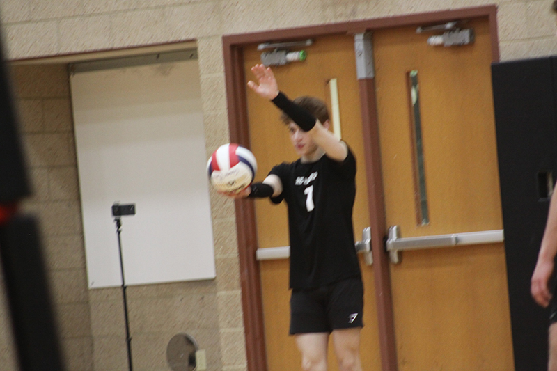 Edrienn Bautista readies a serve for Huntley against Rockford Guilford. The Red Raiders won in two sets, 25-17, 25-19, April 13.