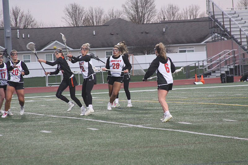 Huntley girls lacrosse players from left, Ashley Zolen, Payton Turczniak and Leah Holmberg battle Crystal Lake Central in an April 19 match.