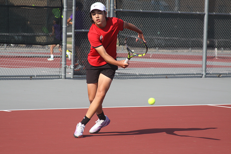 Huntley freshman Will Geske is goes for a point against a Hampshire opponent April 26.