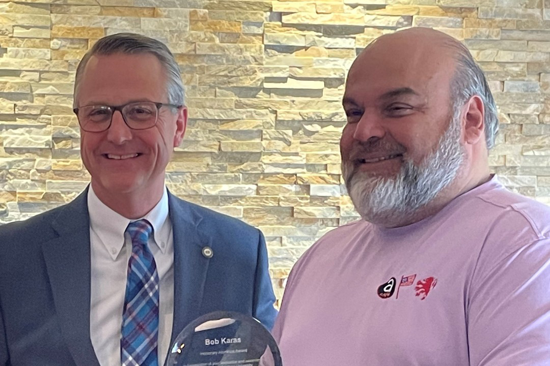 Judson University President Gene Crume (Left) presents business owner Bob Karas with the Honorary Alumni Award