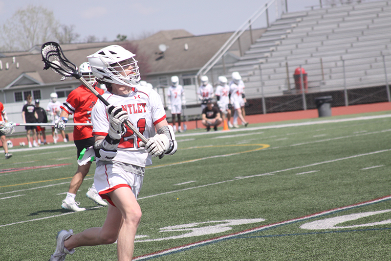 Huntley's Bobby Pupich (21) is on the attack against Grant. He scored six goals in that game.