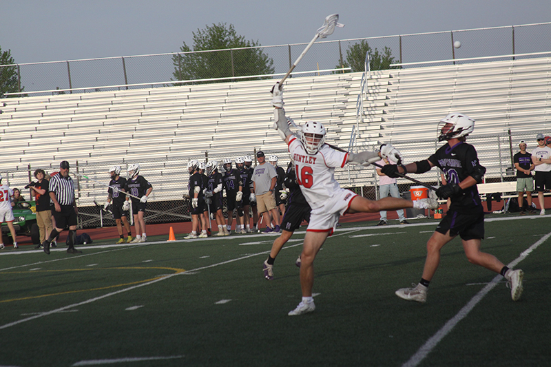 Huntley's Connor Ardell passes the ball against Hampshire. Ardell is one of nine Red Raiders seniors on the lacrosse team.