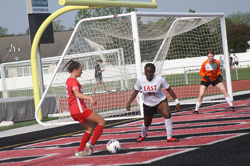 Huntley senior Grace Helzer readies to shoot the ball for a goal against Rockford East in the regional tournament. Helzer finished with 22 goals to lead the Red Raiders.